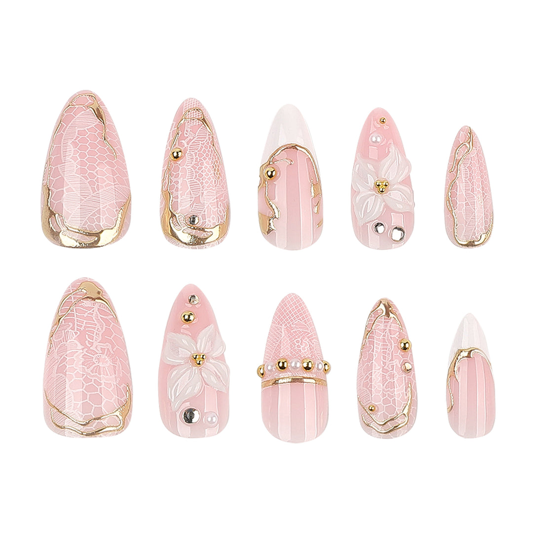 Artful nail extensions with delicate flower and gold embellishments Kalsten