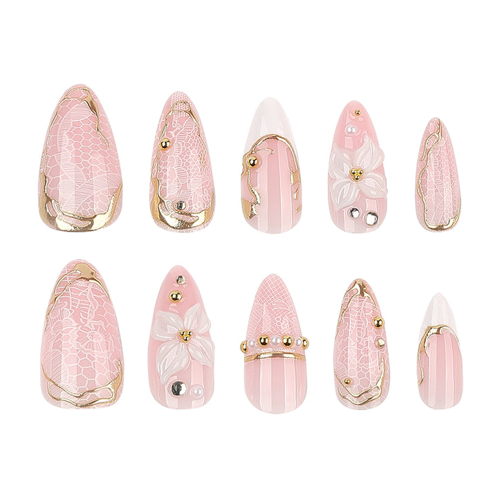 Artful nail extensions with delicate flower and gold embellishments Kalsten