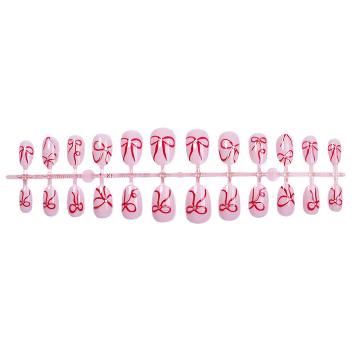 Artificial nail design with bow motifs Kalsten