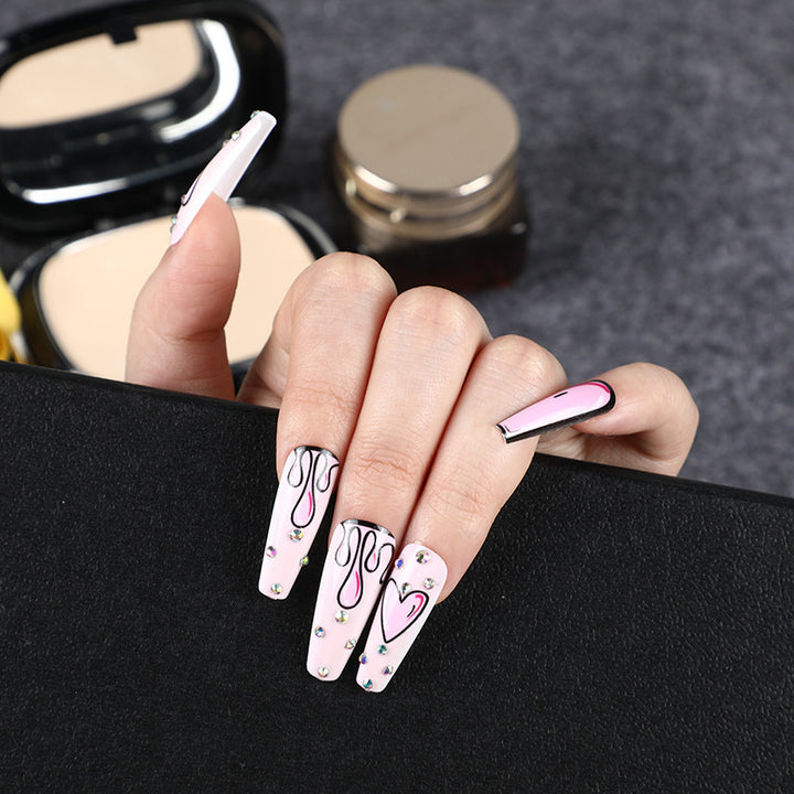 Eye-catching artificial nails with soulful heart design and glamorous accents Kalsten