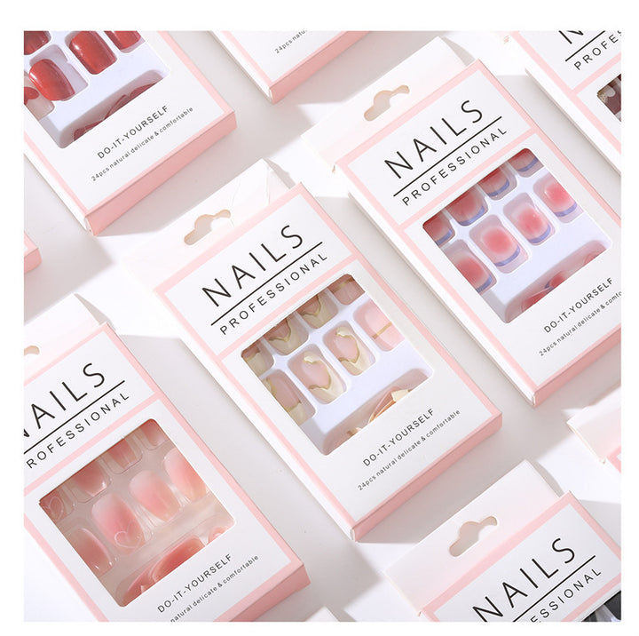 Nail art set with sparkling rhinestone details and heart motifs Kalsten
