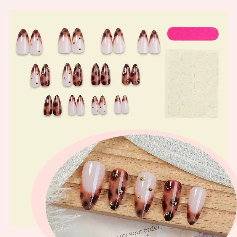 Acrylic nail set with luxurious leopard pattern and golden accents Kalsten