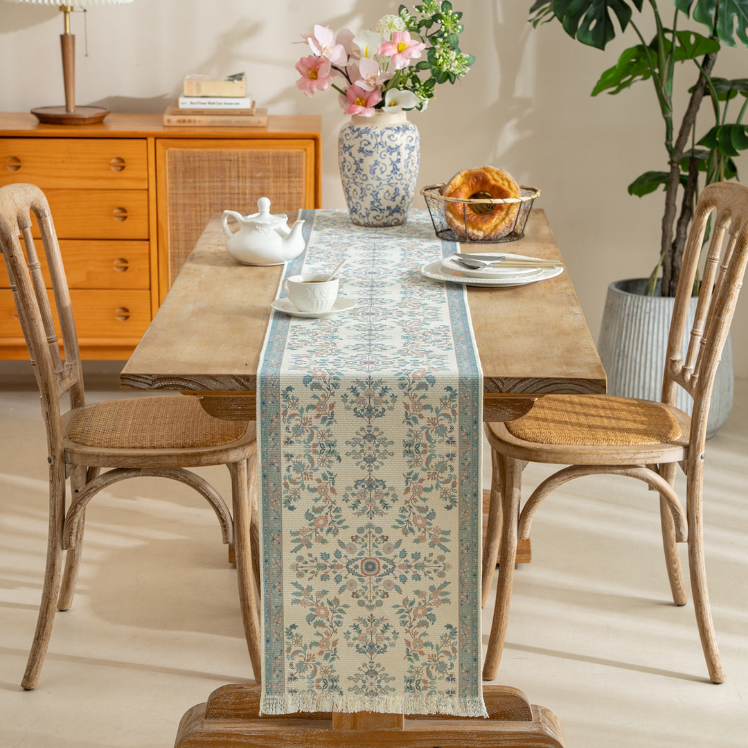 Vintage-inspired woven table runner with floral border and fringes Kalsten