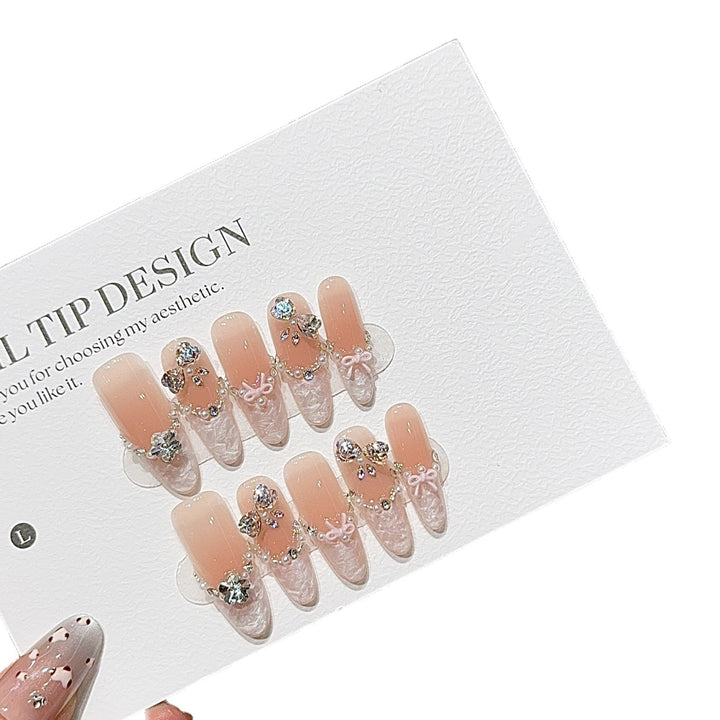 Artificial nails with romantic rhinestone details Kalsten
