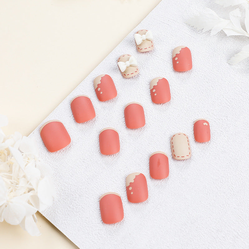 Artistic nail nails with decorative bow designs and French tips Kalsten