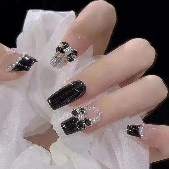 Artistic Nail Art with Glitter and Flower Applications Kalsten