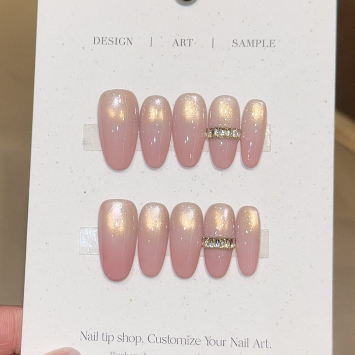 Glamorous artificial nails with elegant glitter and rhinestone application Kalsten