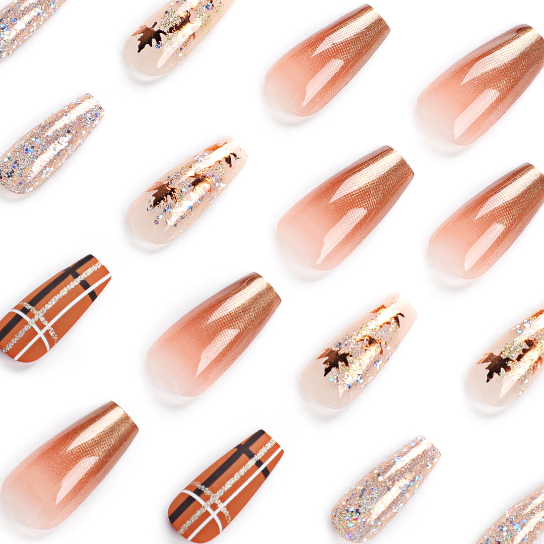 Artful nail extensions with glitter and leaf patterns Kalsten