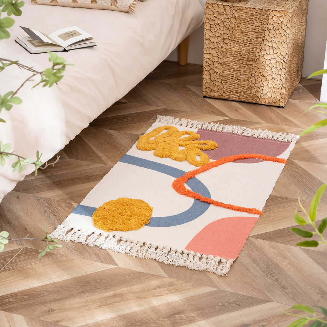 Woven runner with hand-tufted 3D applications and fringes