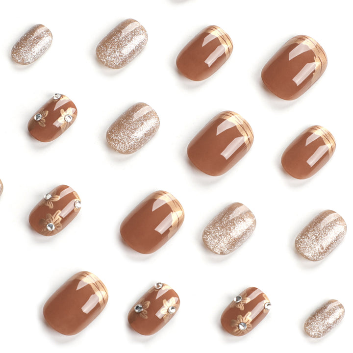 Elegant Nail Decoration with Glitter and Floral Accents Kalsten