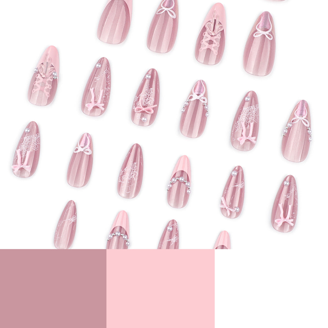 Artful nail extensions with delicate bow motifs Kalsten