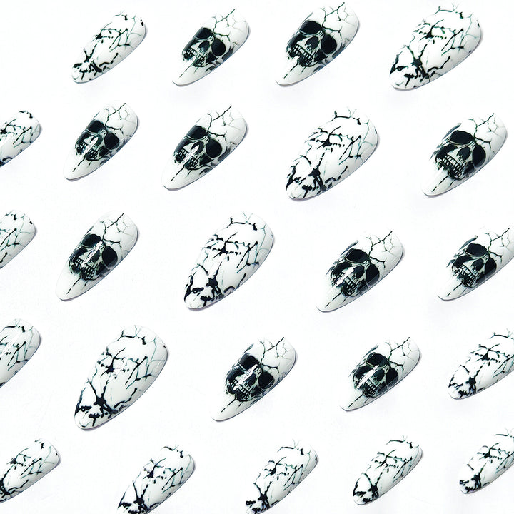 Artificial nails with playful skull design and crackle effects Kalsten