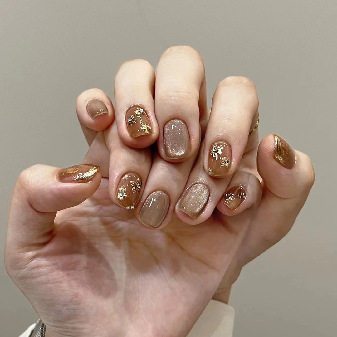Elegant Nail Decoration with Glitter and Floral Accents Kalsten