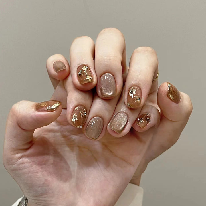 Elegant Nail Decoration with Glitter and Floral Accents Kalsten
