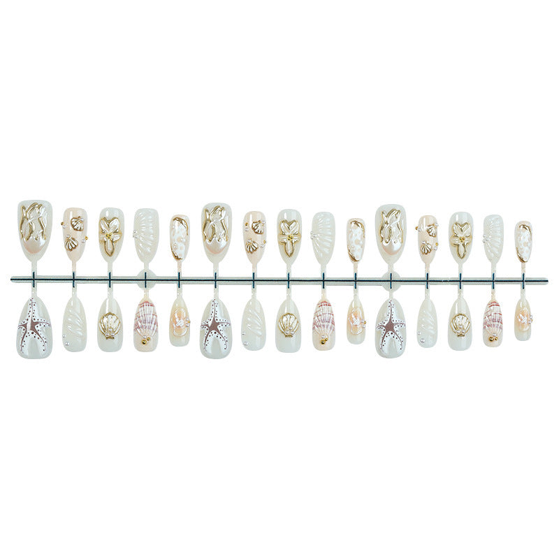 luxurious artificial nail set with maritime designs and golden accents Kalsten