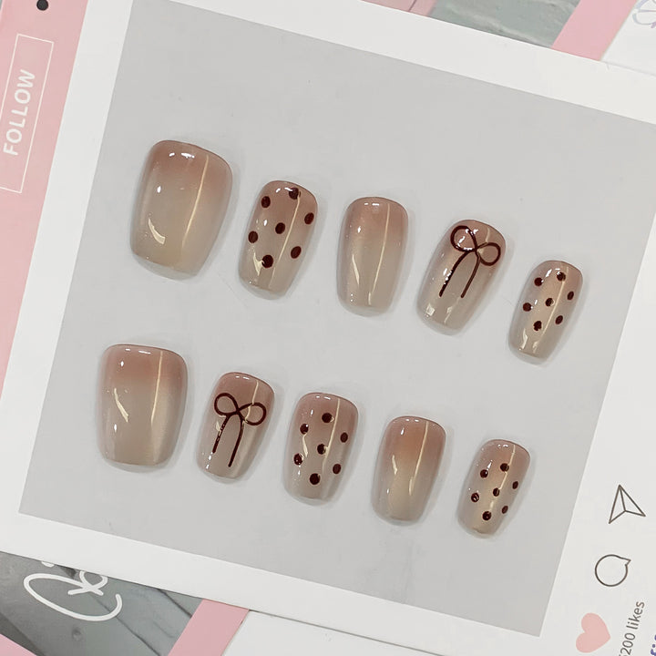 Artificial nail tips with bow and dot patterns Kalsten