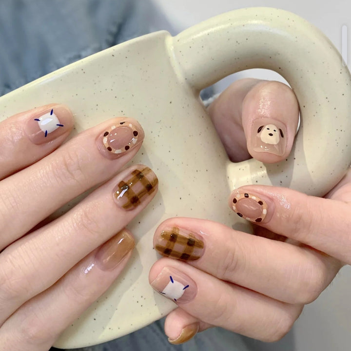 Playful artificial nails with cute animal and pattern accents Kalsten