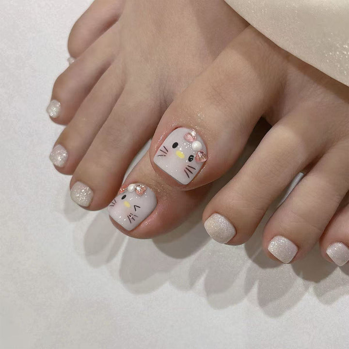 Artful toenail design with cute cat motif Kalsten