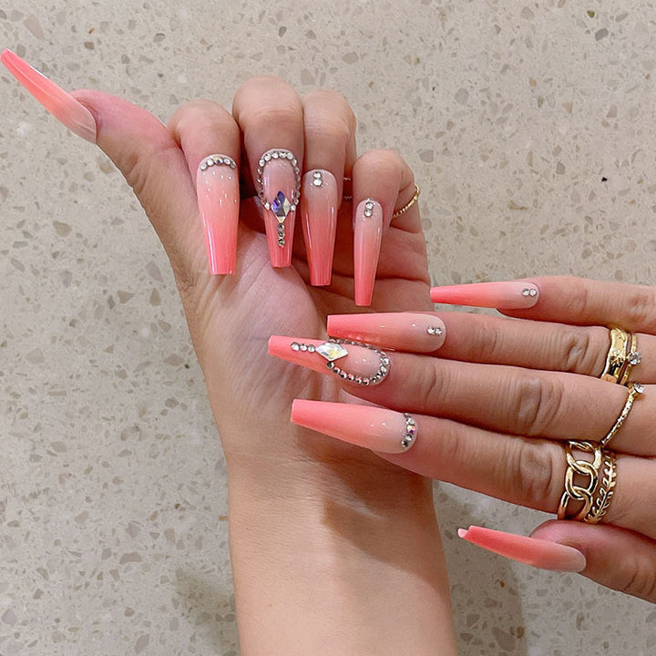 Artificial nails with glitter and stone embellishments Kalsten