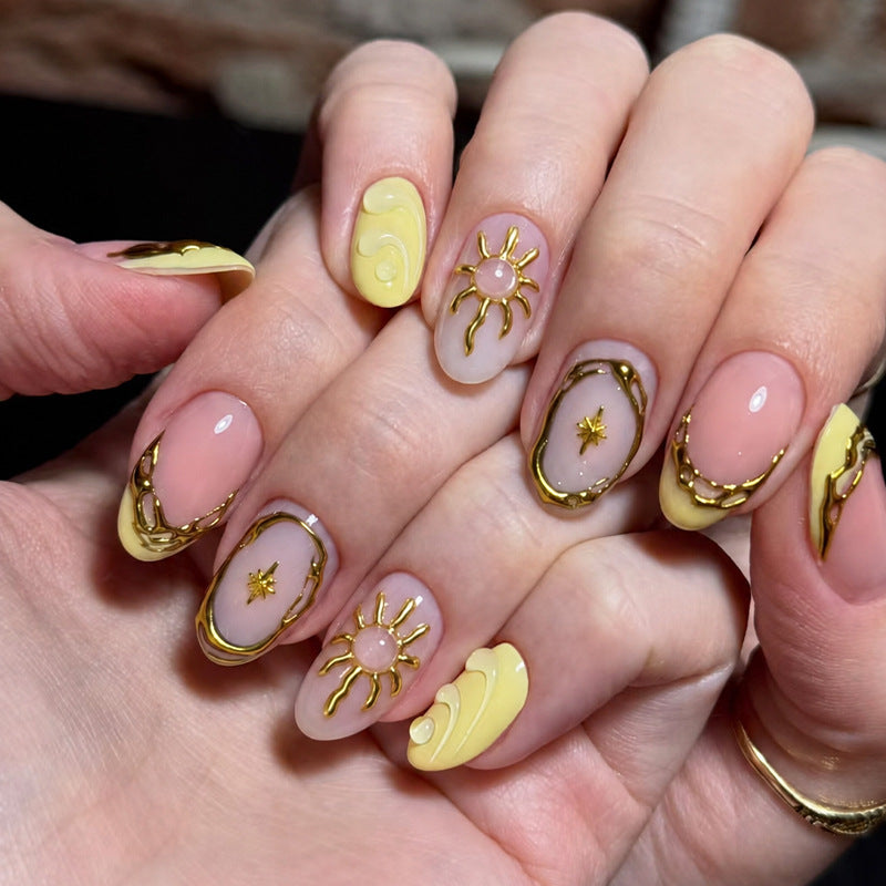 Acrylic nail set with elegant gold embellishments and creative designs Kalsten