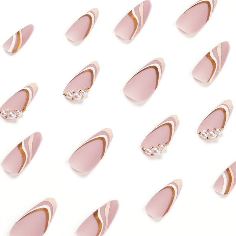 Artful stiletto nails with elegant gold and white accents Kalsten
