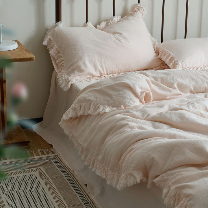 Washed linen bedding set with fringe trim and natural texture