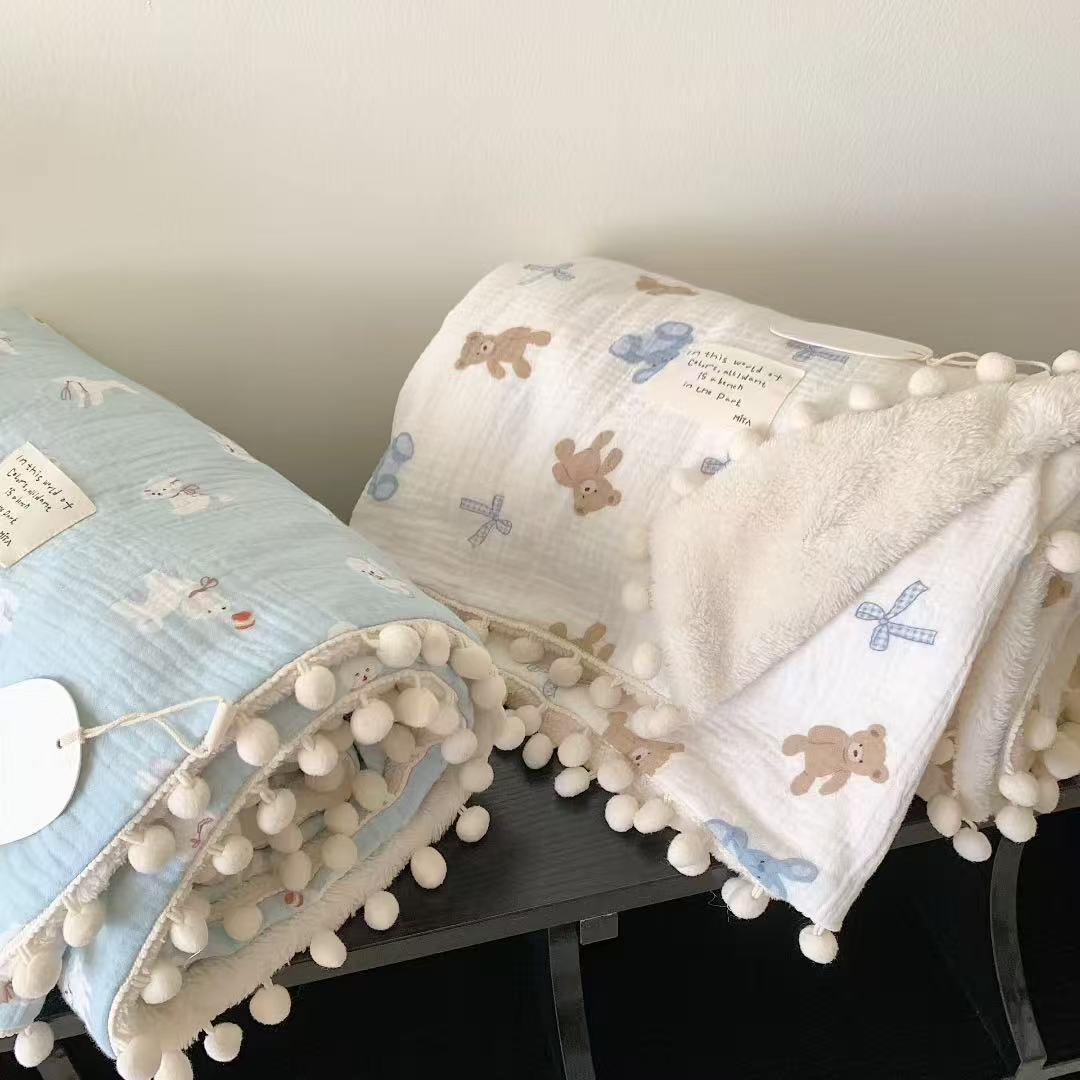 Children's Wende cuddly blanket made of cotton muslin with pompom border