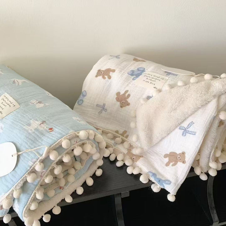 Children's Wende cuddly blanket made of cotton muslin with pompom border