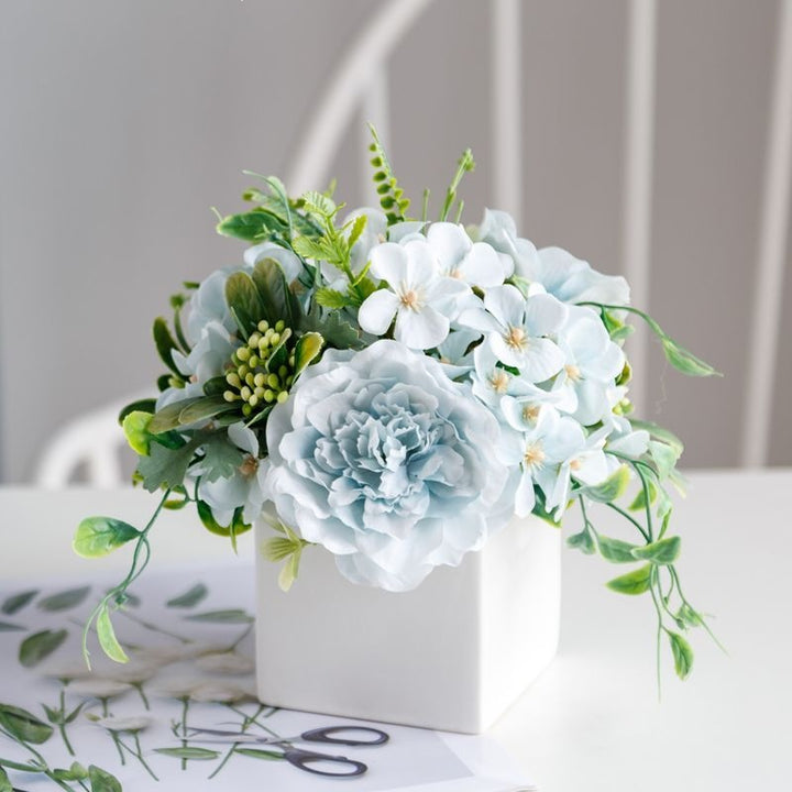 Lifelike Floral Arrangement in Decorative Square Planter