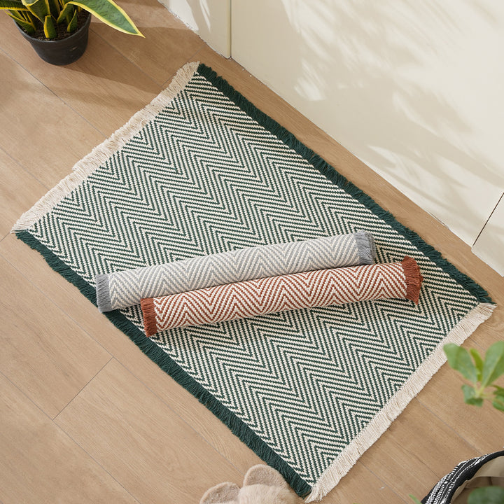Handwoven cotton bath mat with herringbone pattern and fringes Kalsten