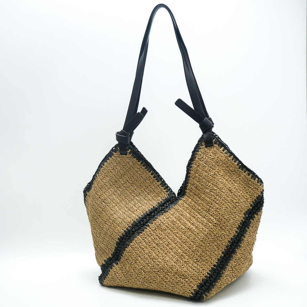 Fashionable beach bag made of woven natural material with leather handles Kalsten