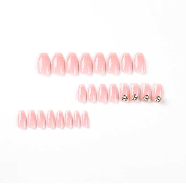 Artful nail extensions with elegant French tip and rhinestone embellishments Kalsten