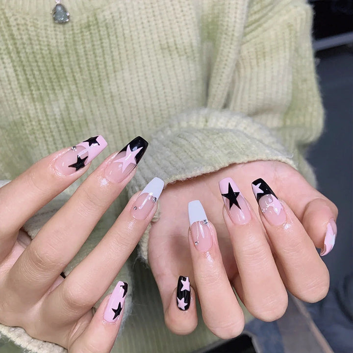 Artificial nail set with glamorous star design and sparkling accents Kalsten