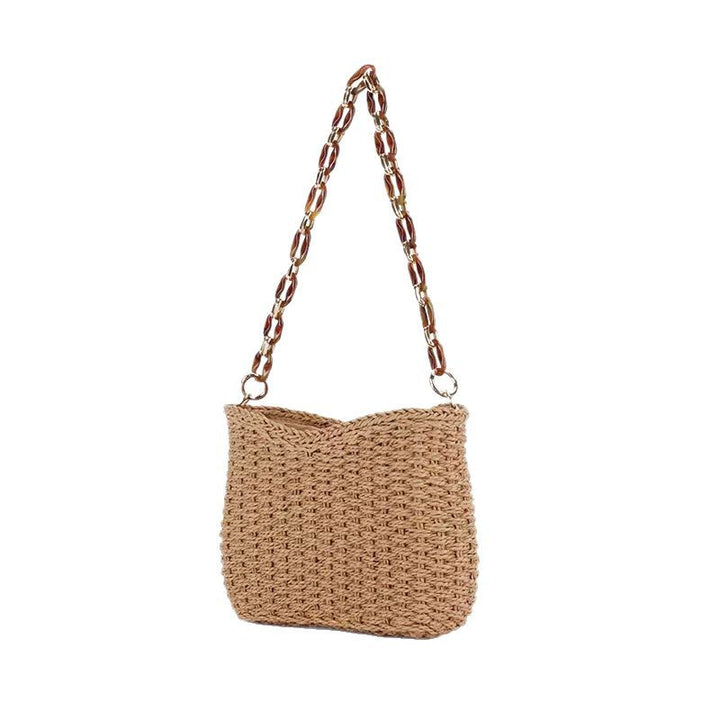Handcrafted straw bag with golden chain details Kalsten