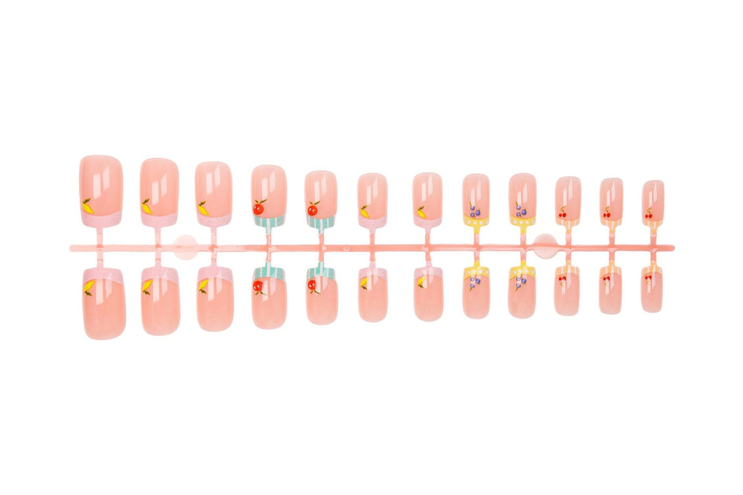 Nail art set with cheerful fruit designs and colorful accents Kalsten