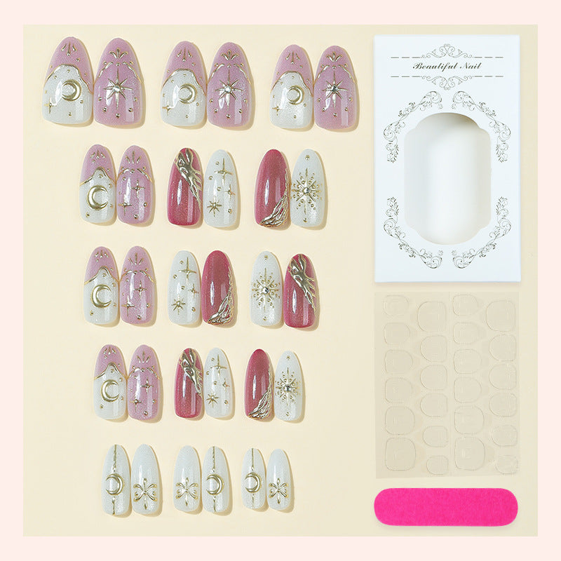 Artificial nail set with delicate gold embellishments and mystical motifs Kalsten