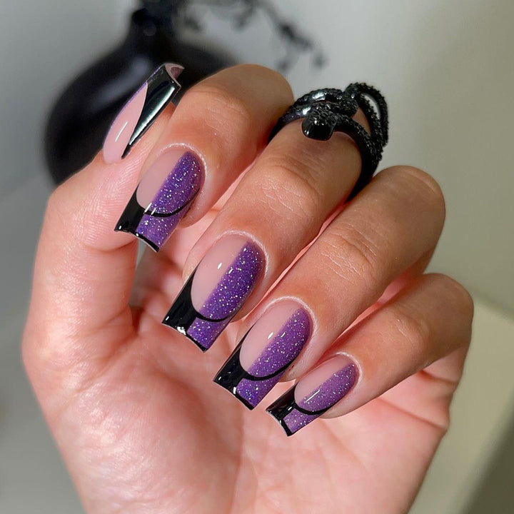 Artful nail extensions with glamorous color gradient and glitter details Kalsten