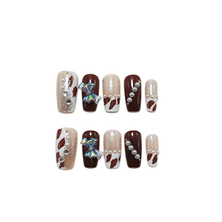 Artificial nails with glamorous rhinestone and bow design Kalsten