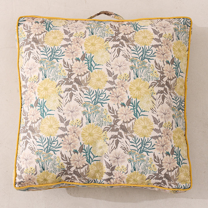 Large square floor cushion with floral cotton cover, piping, and carrying handle Kalsten