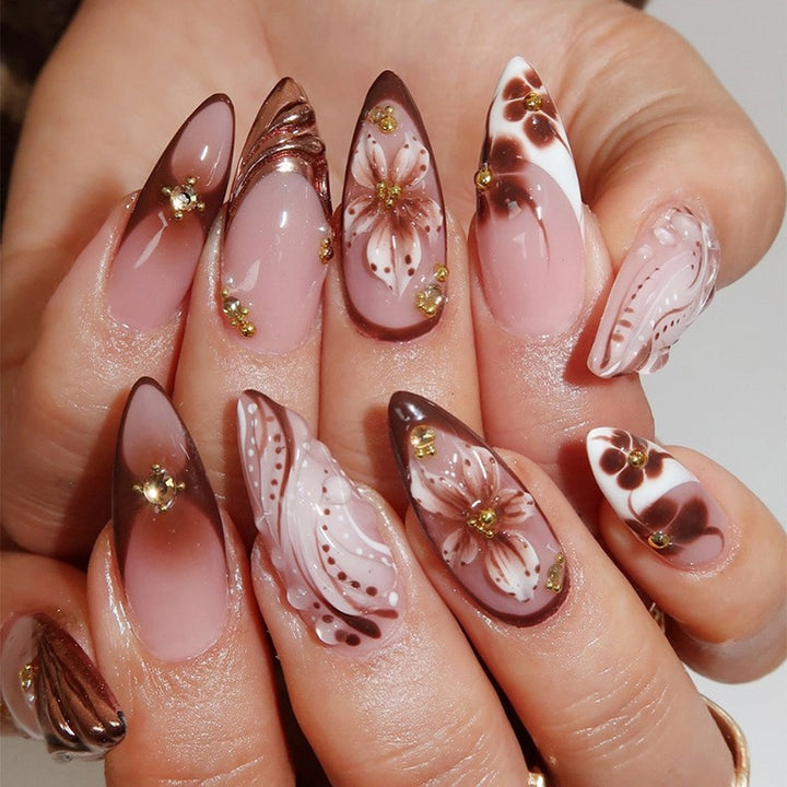Acrylic nail set with elegant 3D flower accents and glamorous designs Kalsten
