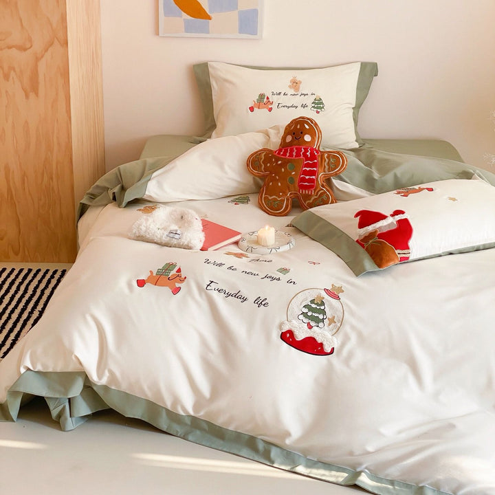 Festive cotton satin bedding set with embroidered Christmas motifs and contrasting borders