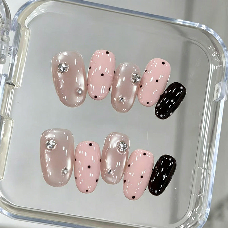 Acrylic nail set with glamorous rhinestone accents and modern dots Kalsten