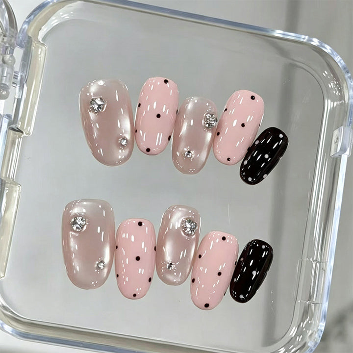 Acrylic nail set with glamorous rhinestone accents and modern dots Kalsten