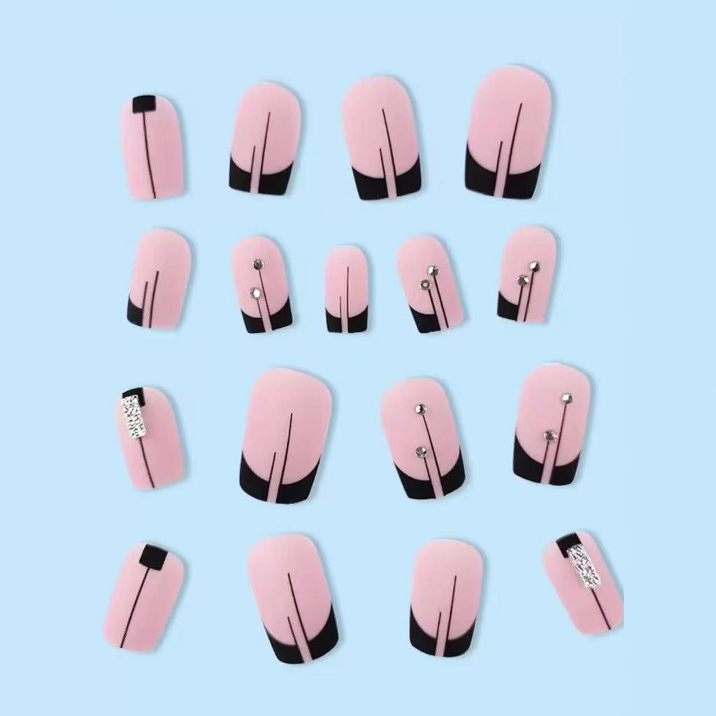 Acrylic nail set with elegant rhinestone accents and stylish lines Kalsten