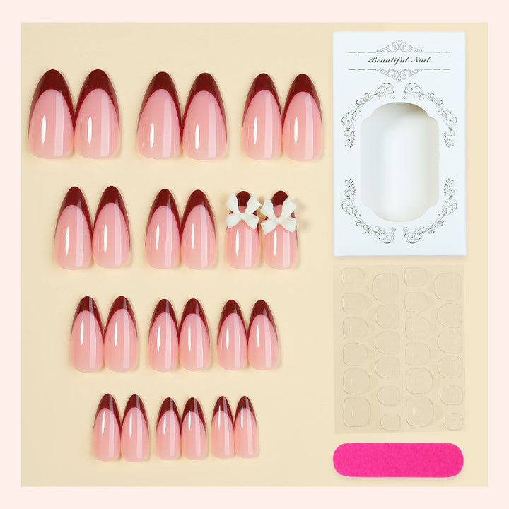 Acrylic nail set with creative French tip design and cute bows Kalsten