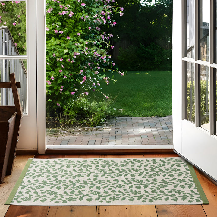 Woven table runner with floral vinyl print look and reinforced overlock stitching Kalsten