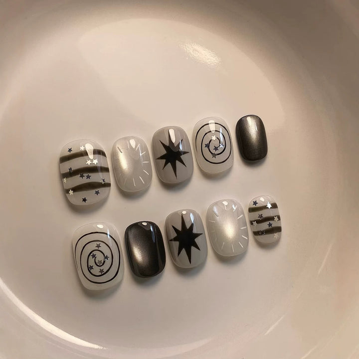 Artistic Press-On Nail Art Set with Celestial Designs