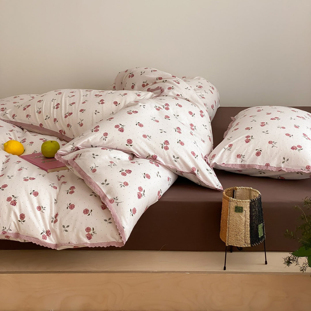 Finely woven cotton percale bedding set with delicate floral print and crocheted lace edge