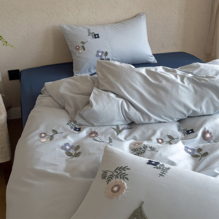 Embroidered cotton bedding set with delicate wildflower embroidery and percale texture