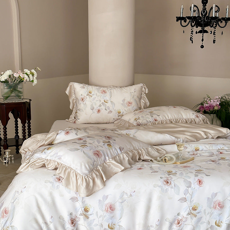 Luxurious satin bedding set with ruffled pillows and delicate watercolor rose print